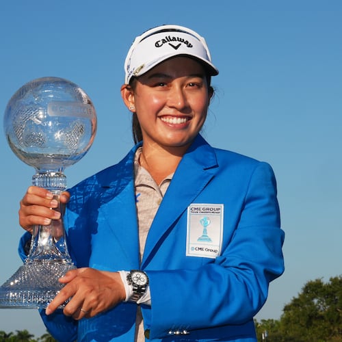Jeeno Thitikul of Thailand holds the CME Global Trophy after winning the LPGA Tour Championship golf tournament, Sunday, Nov. 23, 2025, in Naples, Fla. (AP Photo/Marta Lavandier)
