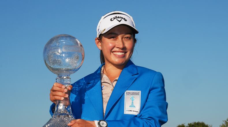 Jeeno Thitikul of Thailand holds the CME Global Trophy after winning the LPGA Tour Championship golf tournament, Sunday, Nov. 23, 2025, in Naples, Fla. (AP Photo/Marta Lavandier)