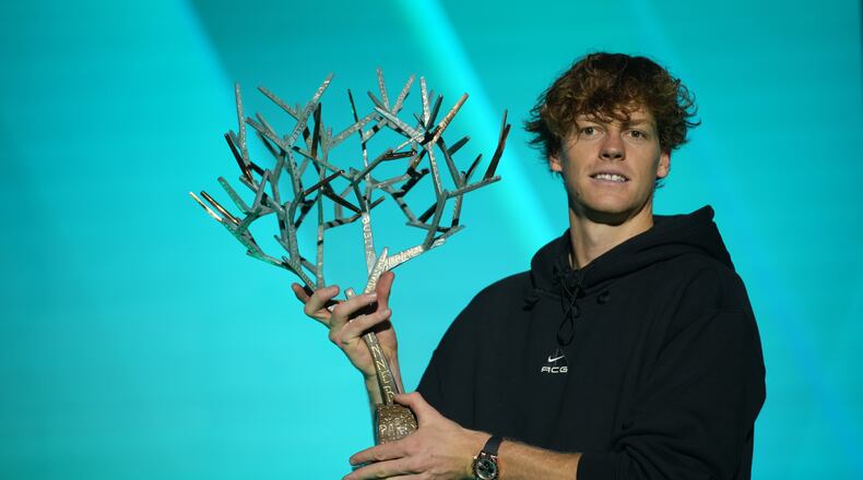 Italy's Jannik Sinner holds the trophy after winning the final match of the Paris Masters tennis tournament against Canada's Felix Auger-Aliassime in Paris, Sunday, Nov. 2, 2025. (AP Photo/Christophe Ena)