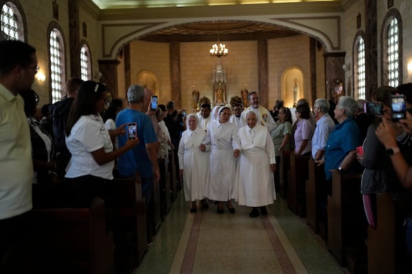 Nuns and priest attend a celebratory Mass for Blessed Maria Carmen Rendiles at the Belen's school church where are their remains in Caracas, Venezuela, Monday, March 31, 2025. (AP Photo/Ariana Cubillos)