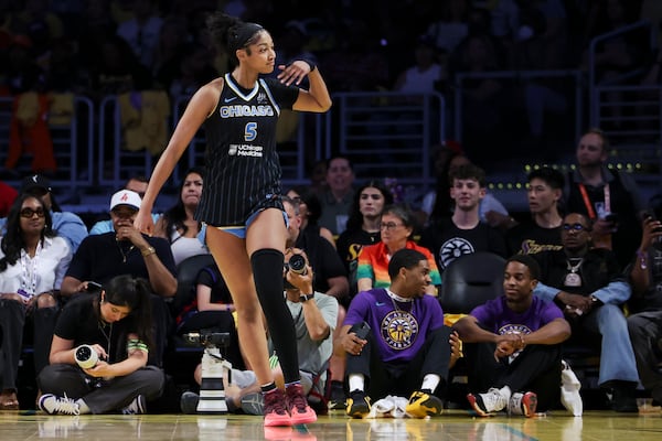Chicago Sky forward Angel Reese gestures towards the crowd after scoring during the second half of a WNBA basketball game against the Los Angeles Sparks, Sunday, June 29, 2025, in Los Angeles. (AP Photo/Jessie Alcheh)
