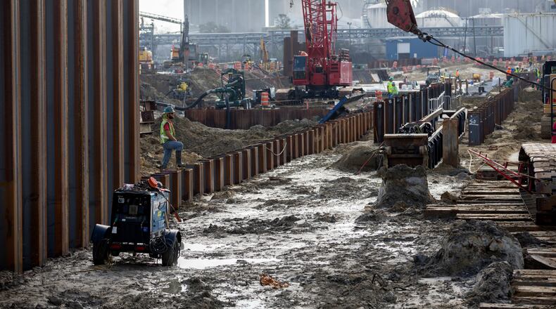 Contractors working for the Georgia Ports Authority recently rebuilding a berth at the Garden City Terminal in Savannah to accommodate larger ships. The authority has also recently coordinated with the U.S. Department of Transportation to increase rail capacity and open inland container yards. (2021 file photo) (AJC Photo/Stephen B. Morton)