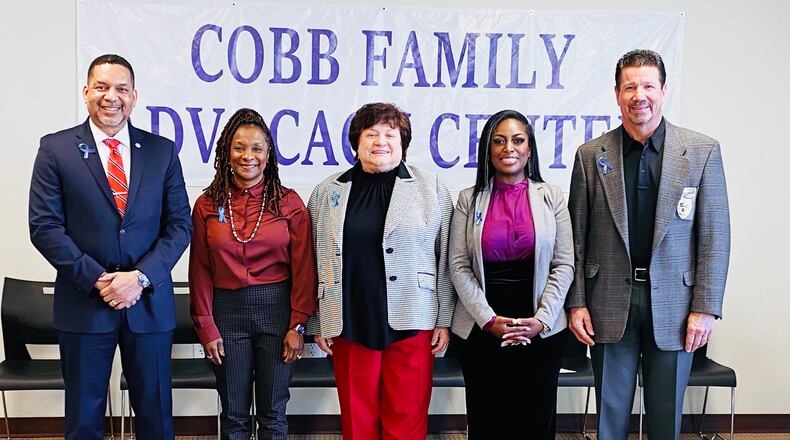 Shown left to right: Cobb County District Attorney Flynn Broady, County Manager Jackie McMorris, property management Sharon Stanley, the family advocacy center site developer Tanesha McAuley, and Public Safety Director Randy Crider gathered to dedicate the new family advocacy center on Thursday, December 15, 2022. Courtesy of Cobb County