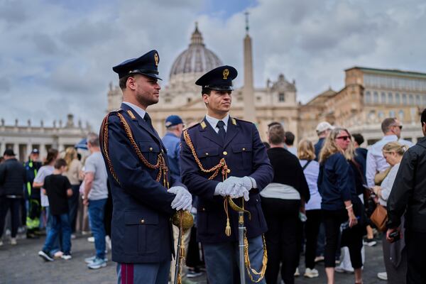 Carabinieri paramilitary police patrol St. Peter's Square as people line up to enter St. Peter's Basilica where Pope Francis is lying in state, at the Vatican, Thursday, April 24, 2025. (AP Photo/Bernat Armangue)