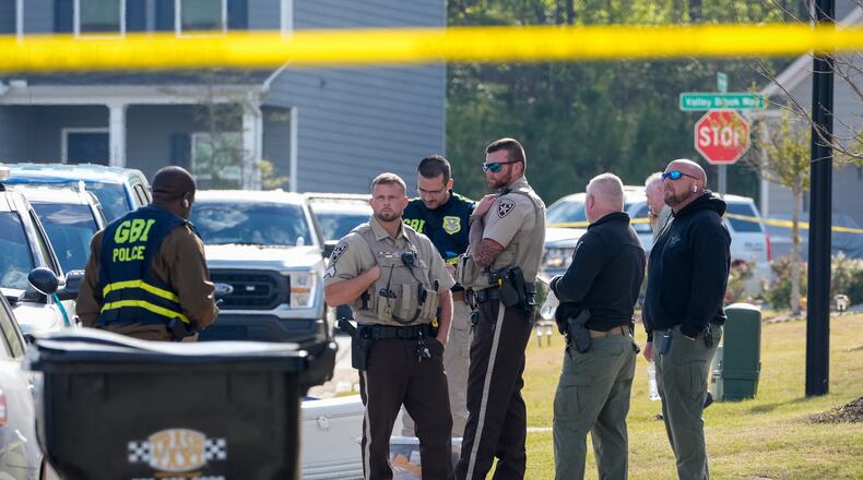 GBI officials responded to a Paulding County neighborhood Thursday after deputies shot and killed a man. (Ben Hendren for The Atlanta Journal-Constitution)