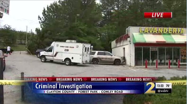 Police are investigating a body that was discovered behind a Forest Park laundromat Saturday morning.