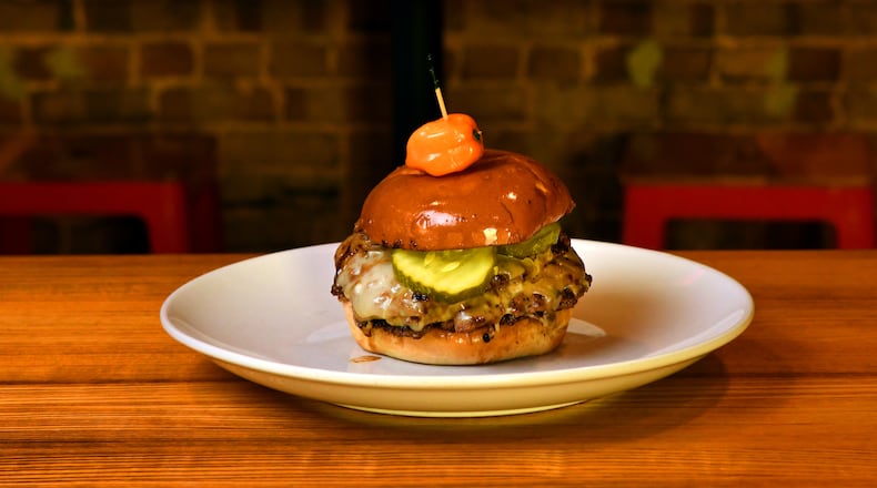 Looking to do more with your burgers this summer? Local Republic's Pepper Jack Loves Fraggle Rock Smash Burger was one of the intriguing options at Explore Gwinnett's Burger Week. (Styling by chef Brian Hill / Chris Hunt for the AJC)