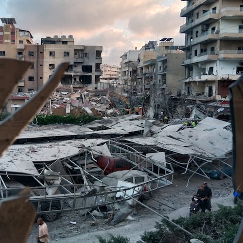 A destroyed building that was hit in an Israeli airstrike is seen through a shattered window of the Jabal Amel Hospital, in the southern port city of Tyre, Lebanon, Monday, June 1, 2026. (AP Photo)