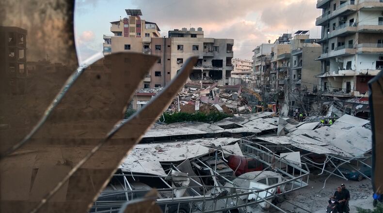 A destroyed building that was hit in an Israeli airstrike is seen through a shattered window of the Jabal Amel Hospital, in the southern port city of Tyre, Lebanon, Monday, June 1, 2026. (AP Photo)