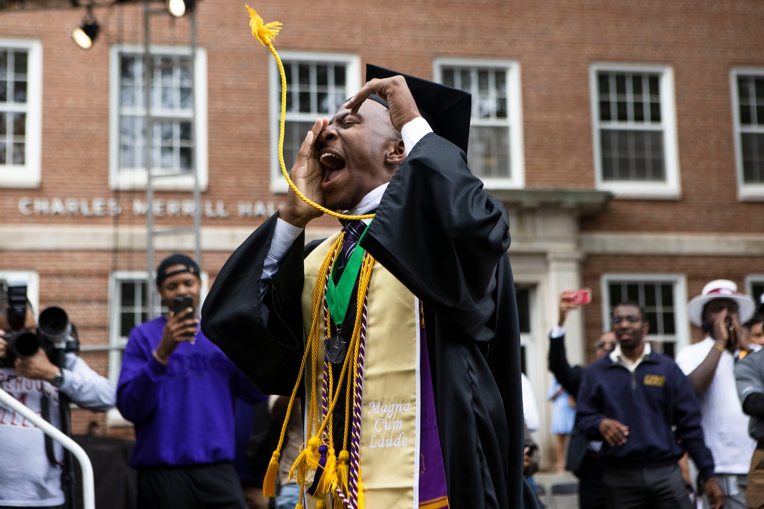 Miles Johnson cheers as he ascends the stage to accept his diploma during the Morehouse College commencement ceremony on Sunday, May 21, 2023, on Century Campus in Atlanta. The graduation marked Morehouse College's 139th commencement program. CHRISTINA MATACOTTA FOR THE ATLANTA JOURNAL-CONSTITUTION