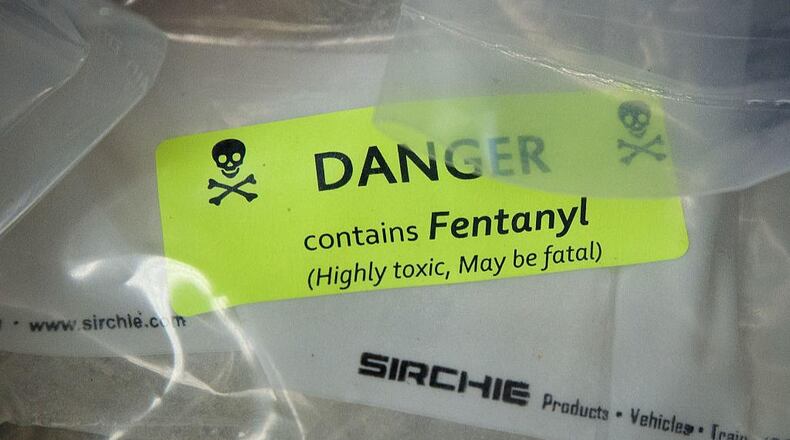 Bags of heroin, some laced with fentanyl, are displayed before a press conference after a drug bust. Authorities believe fentanyl may be responsible for a mass drug overdose Saturday that killed at least one person and injured a dozen more.