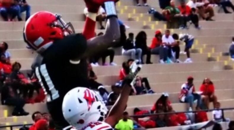 Malachi Jackson (11), shown here scoring one of his three touchdowns against Druid Hills, scored on a pair of touchdown receptions to help lead the Mustangs to a 24-0 win over North Clayton to break a 25-game skid for the Mustangs. (Photo by Mark Brock)