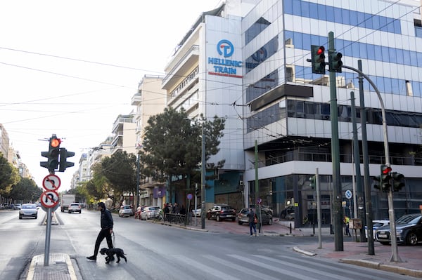 The logo of Hellenic Train, Greece's main railway company, is seen outside company's headquarters, following a bomb explosion Friday night causing causing limited damage but no injuries, in Athens, Greece, on Saturday, April 12, 2025. (AP Photo/Yorgos Karahalis)