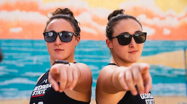 Bella Ferary (L) and her twin sister Angel are senior stalwarts for the school's nationally ranked beach volleyball team. (Photo by Daniel Wilson/Georgia State Athletics)