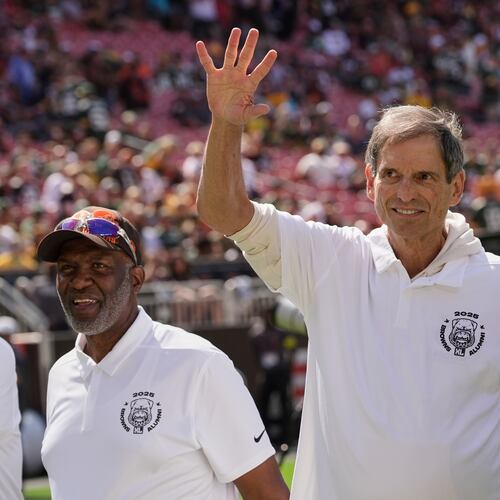 FILE - Former Cleveland Browns quarterback Bernie Kosar waves during a Browns' Alumni event before an NFL football game between the Green Bay Packers and the Cleveland Browns in Cleveland, Sunday, Sept. 21, 2025. (AP Photo/Sue Ogrocki, File)