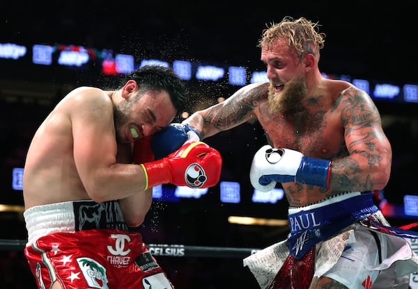 Jake Paul (right) punches Julio Cesar Chavez Jr. during a June fight in Anaheim, Calif. (Harry How/TNS)