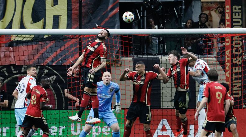 Atlanta United defender Derrick Williams (3) rejects the ball with a header during the second half against the Chicago Fire at Mercedes-Benz Stadium on Sunday, March 31, 2024.
 Miguel Martinez / miguel.martinezjimenez@ajc.com