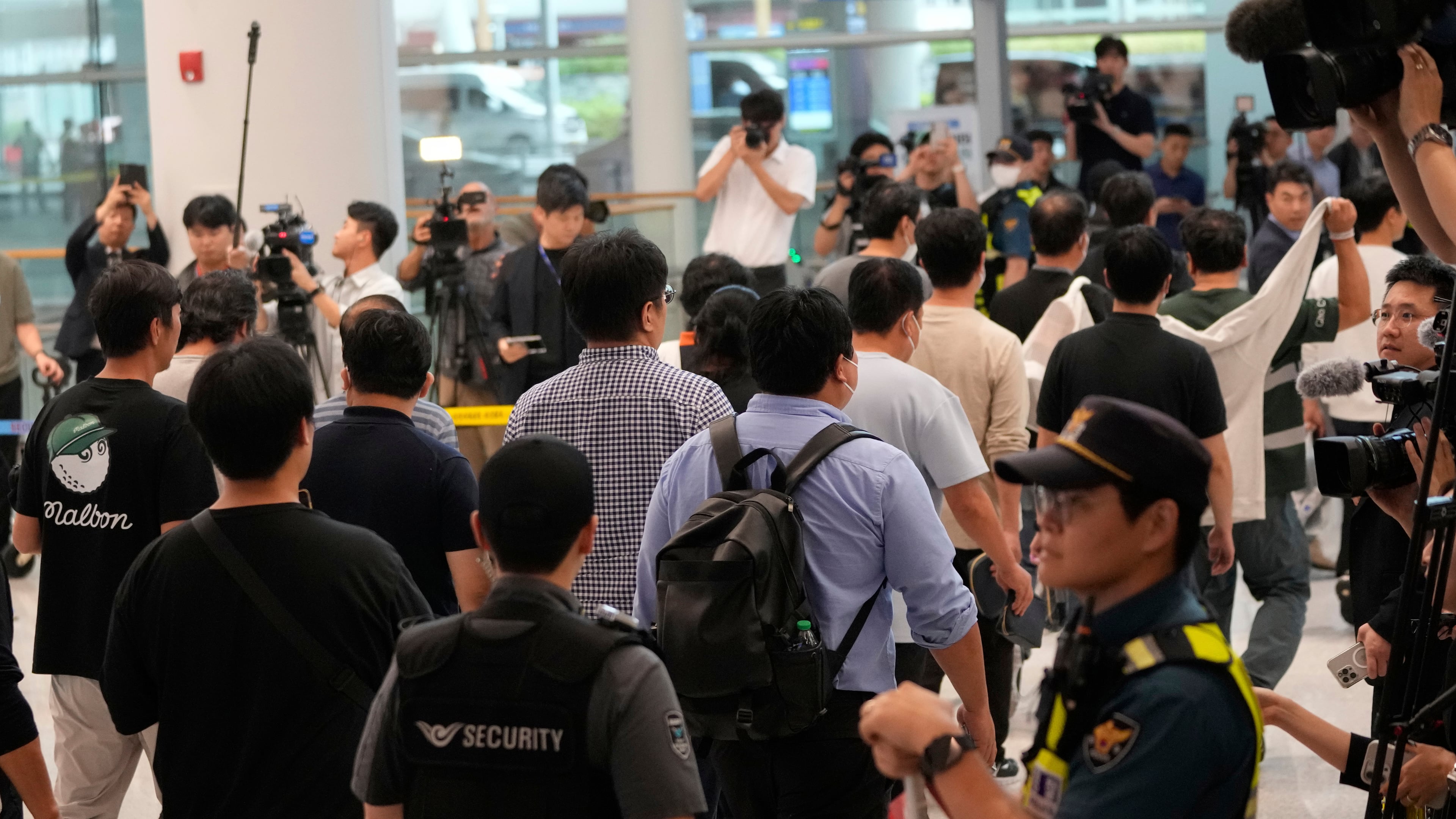 South Korean workers released after days of detention in Georgia arrive at the Incheon International Airport, in Incheon, South Korea, Friday, Sept. 12, 2025. (AP Photo/Ahn Young-joon)