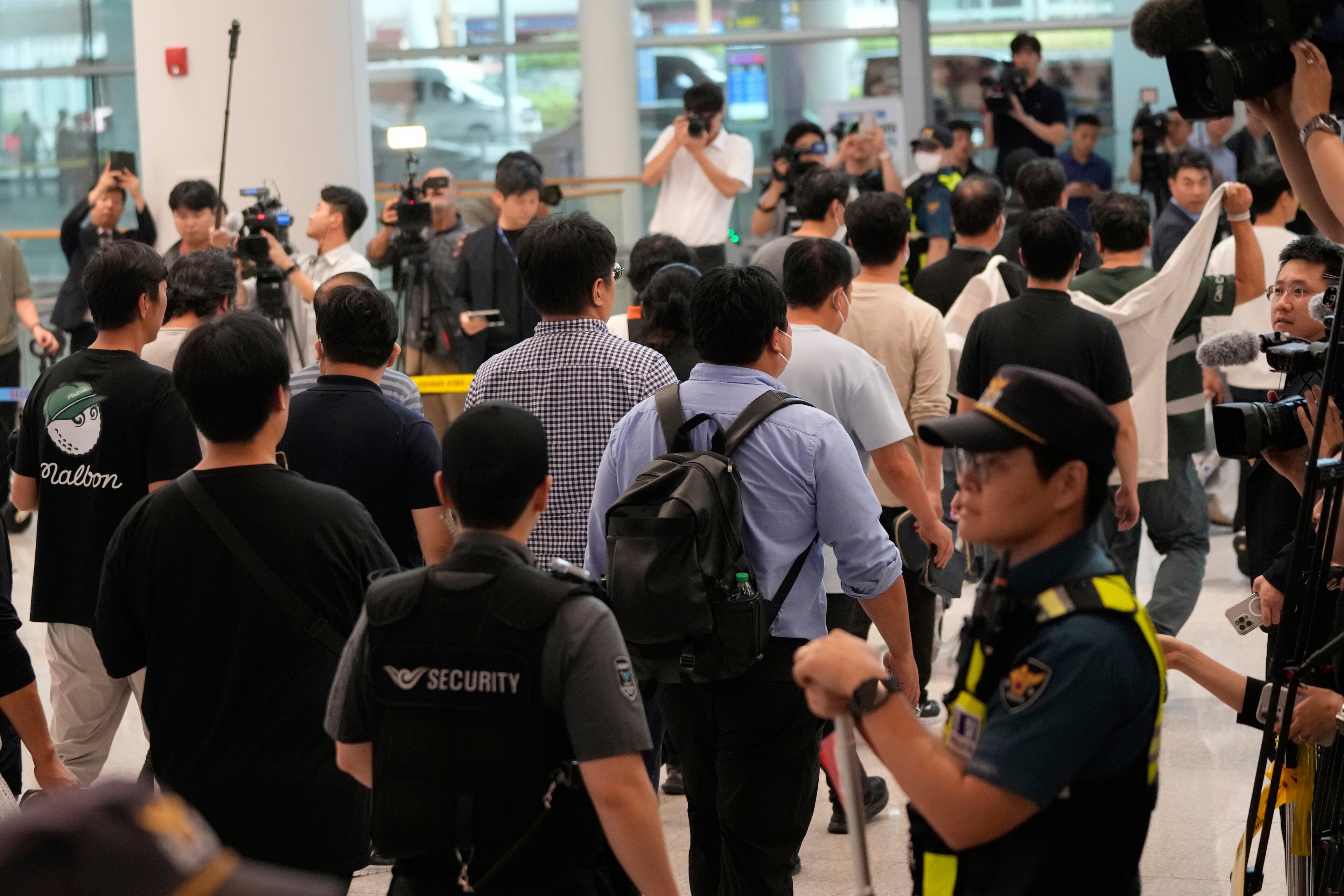 South Korean workers released after days of detention in Georgia arrived today at the Incheon International Airport in South Korea.