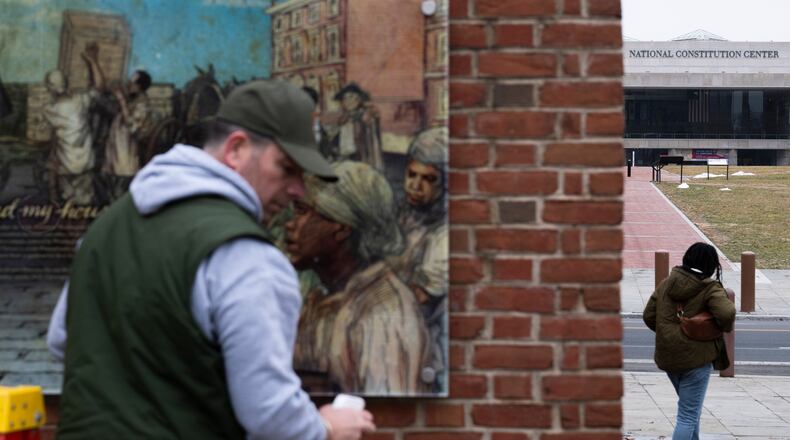FILE - Panels that were part of an exhibit on slavery at the President's House Site in Philadelphia are put back on Feb. 19, 2026. (AP Photo/Joe Lamberti, File)