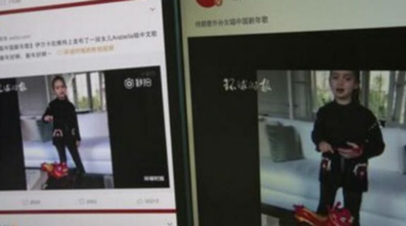 Computer screens display a video clip showing President Donald Trump's granddaughter, Arabella Kushner, singing a Chinese New Year greeting song that garnered almost 20 million views in Beijing, China.