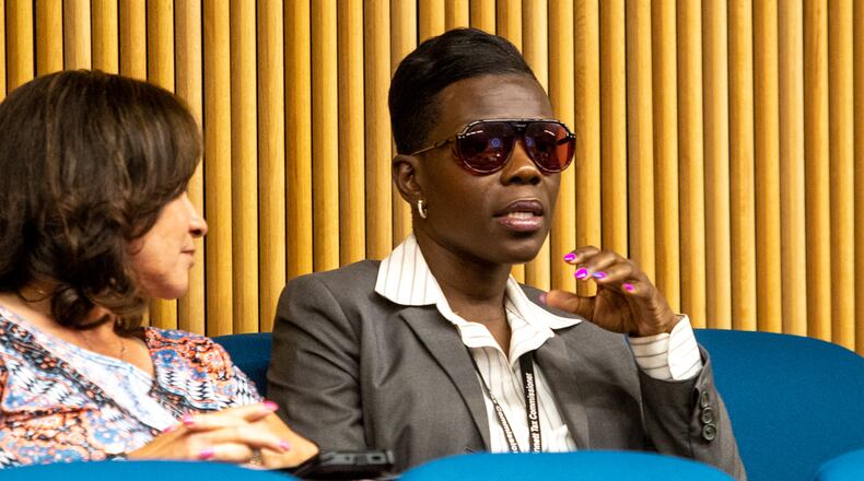 Tax commissioner Tiffany Porter, right, briefly attends the Gwinnett County Board of Commissions meeting Tuesday, June 15, 2021. (Jenni Girtman for The Atlanta Journal-Constitution)