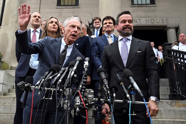 William Read, left, father of Karen Read, behind him, speaks after she was found not guilty of second-degree murder on Wednesday, June 18, 2025, in Dedham, Mass. (AP Photo/Josh Reynolds)