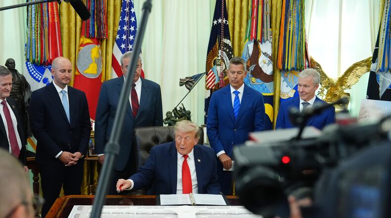 President Donald Trump speaks in the Oval Office of the White House about Dulles International Airport modernization, Wednesday, July 29, 2026, in Washington. (AP Photo/Julia Demaree Nikhinson)