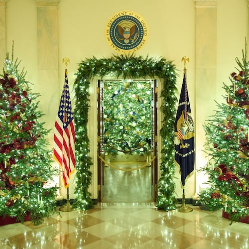 Christmas trees decorate the Cross Hall of the White House during a press preview of the Christmas decorations "Home is Where the Heart Is," Monday, Dec. 1, 2025, in Washington. (AP Photo/Evan Vucci)