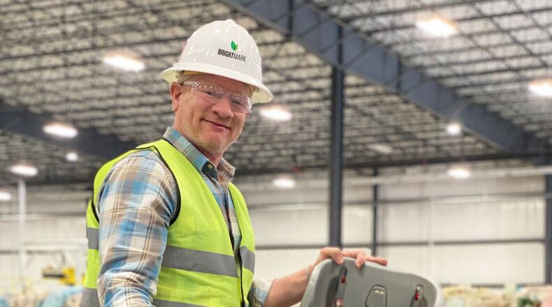 Bob Powell, CEO of Brightmark, looks over plastic products being processed at the company's plastic processing facility in Ashley, Indiana. The facility has had trouble getting up to speed, slowed by a fire last year and other issues. The proposed plant in Macon would be four times larger at about half a million square feet. Concerns by some residents about pollution from the proposed plant got the attention of Lester Miller, who no longer supports it.