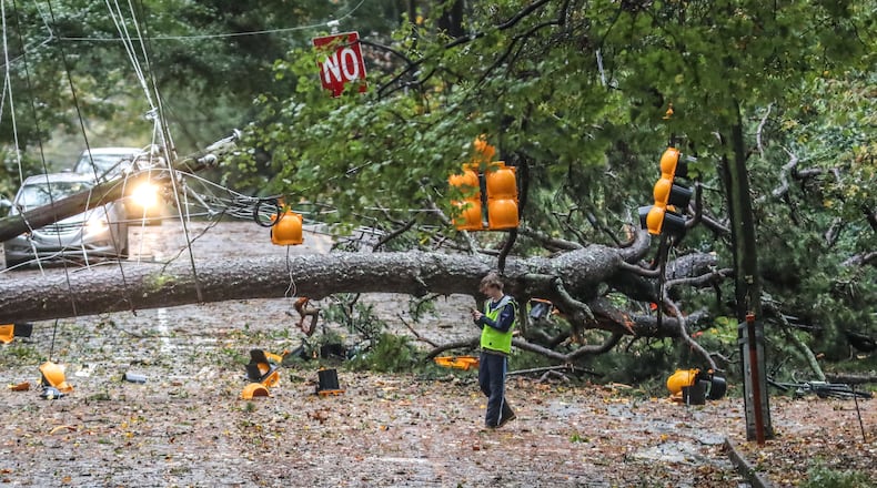 A large tree fell across West Wesley Road and Habersham Road, where it remained closed most of the day Thursday, Oct. 29, 2020. Rain bands and damaging winds from Tropical Storm Zeta swept through North Georgia that morning, leaving at least one person dead and nearly 1 million in the dark. Zeta made U.S. landfall the previous day as a Category 2 hurricane, lashing the Louisiana coast with 110 mph winds. (John Spink/Atlanta Journal-Constitution/TNS)