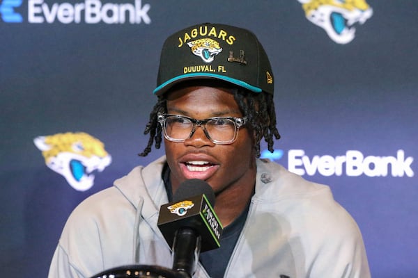 Two-way player Travis Hunter, the Jacksonville Jaguars first round draft pick, second overall, talks with reporters during an NFL football press conference, Friday, April 25, 2025, in Jacksonville, Fla. (AP Photo/Gary McCullough)