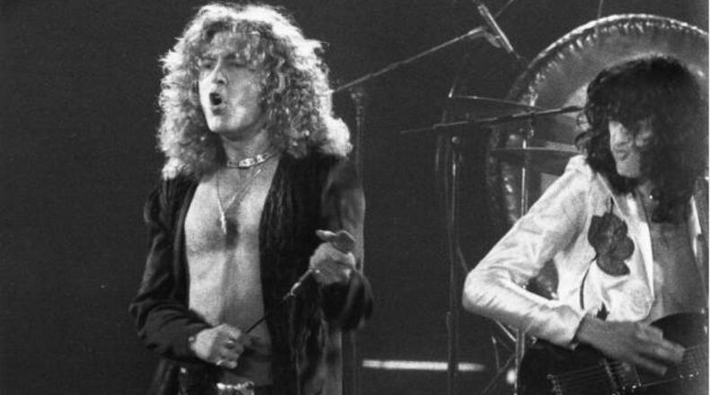 Robert Plant and Jimmy Page of Led Zeppelin perform live in Atlanta in May 1977. AJC file photo: Rick Diamond