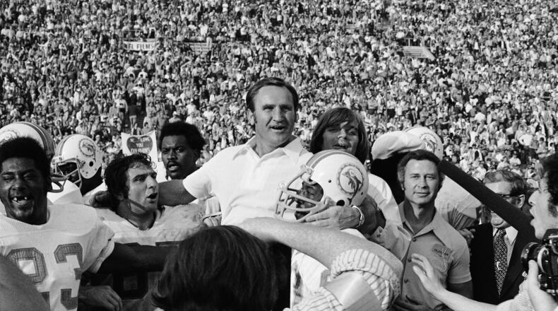 In this Jan. 14, 1973 file photo, Miami Dolphins coach Don Shula is carried off the field after his team won the Super Bowl game with a 14-7 victory over Washington, in Los Angeles. The Dolphins team that achieved the only perfect season in NFL history will be honored by the White House next Tuesday, Aug. 20, 2013, more than 40 years after its accomplishment. (AP Photo/File)