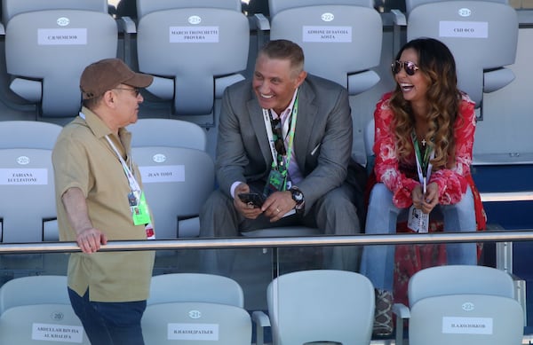 (From left) Arkady Rotenberg, his brother Boris Rotenberg, and Boris Rotenberg's wife Karina Rotenberg are seen during the awarding ceremony at the 2017 Formula 1 Russian Grand Prix in Sochi, Russia, on April 30, 2017. (Mikhail Svetlov/Getty Images)