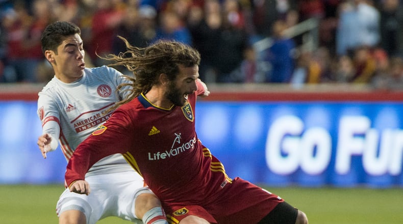 Real Salt Lake midfielder Kyle Beckerman, right, goes for the ball as Atlanta United midfielder Miguel Almiron defends in an MLS soccer match in Salt Lake City on Wednesday, April 22, 2017. (Rick Egan/The Salt Lake Tribune via AP)