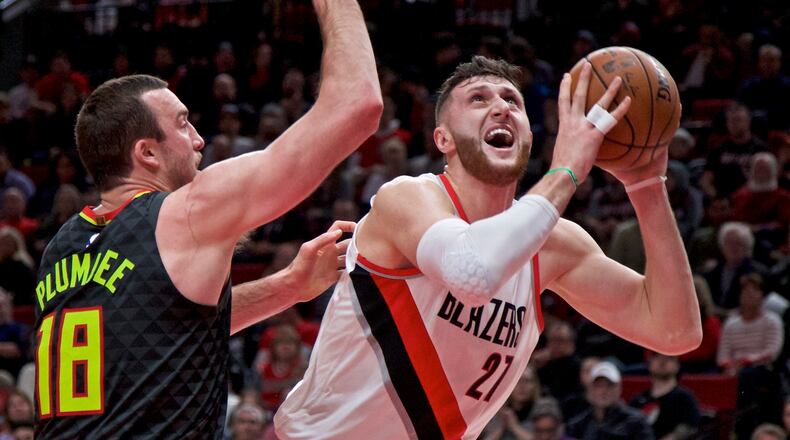 Portland Trail Blazers center Jusuf Nurkic, right, shoots over Atlanta Hawks center Miles Plumlee during the first half of an NBA basketball game in Portland, Ore., Friday, Jan. 5, 2018. (AP Photo/Craig Mitchelldyer)