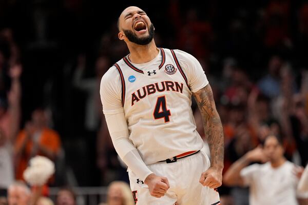 Auburn forward Johni Broome (4) reacts to play against Michigan State during the second half in the Elite Eight of the NCAA college basketball tournament, Sunday, March 30, 2025, in Atlanta. (AP Photo/George Walker IV)