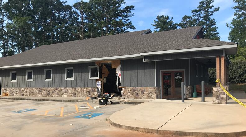 Troup County deputies are searching for a group of burglars who drove a stolen truck through the side of a LaGrange gun shop early Wednesday before taking an unspecified number of firearms.