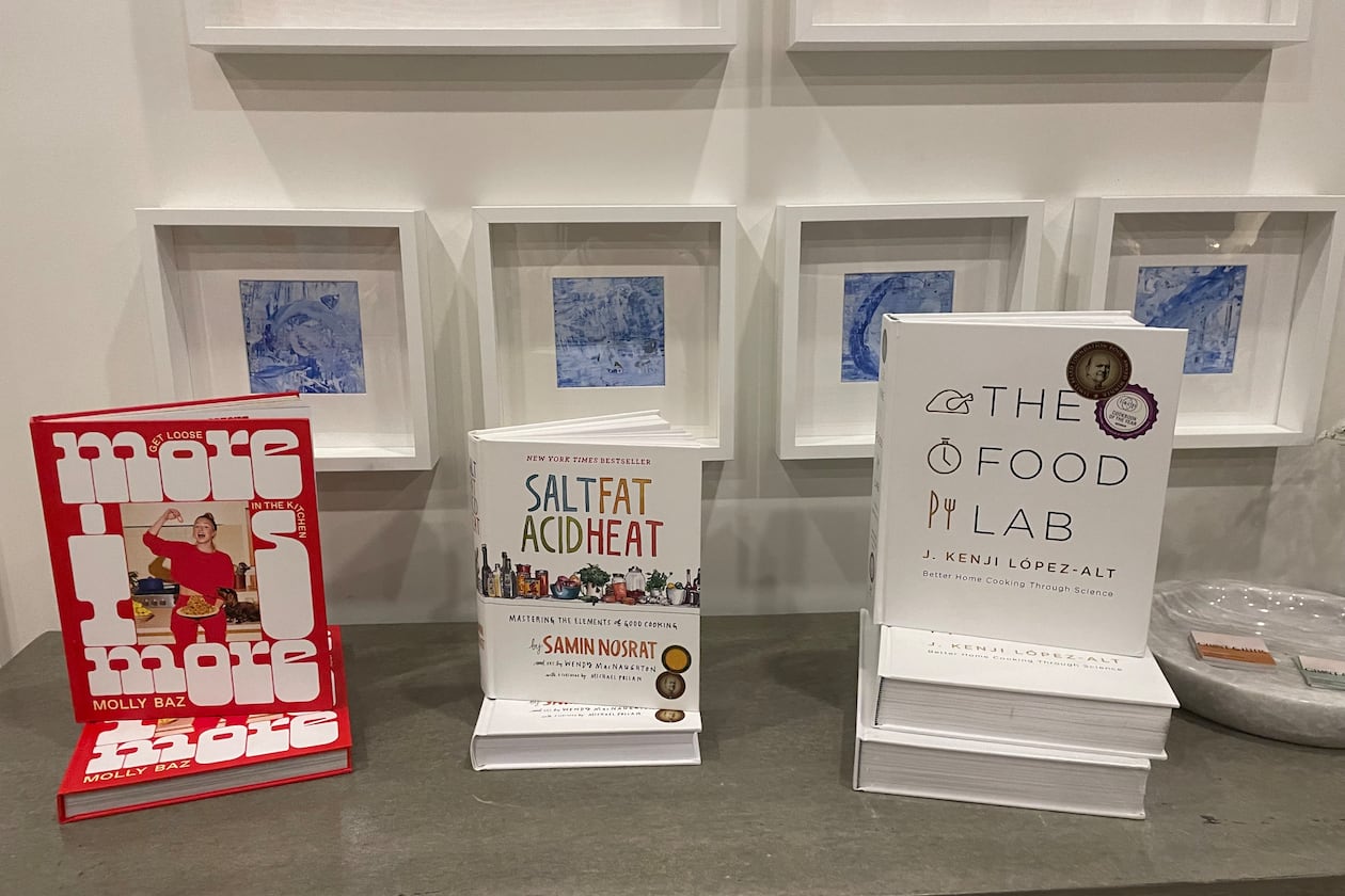 Press Shop has been hosting a cookbook club since 2021. Each gathering spotlights recipes from three cookbooks. One event featured “More is More” by Molly Baz, “Salt Fat Acid Heat” by Samin Nosrat and “The Food Lab” by J. Kenji Lopez-Alt. (Courtesy of Melissa Haghighat)