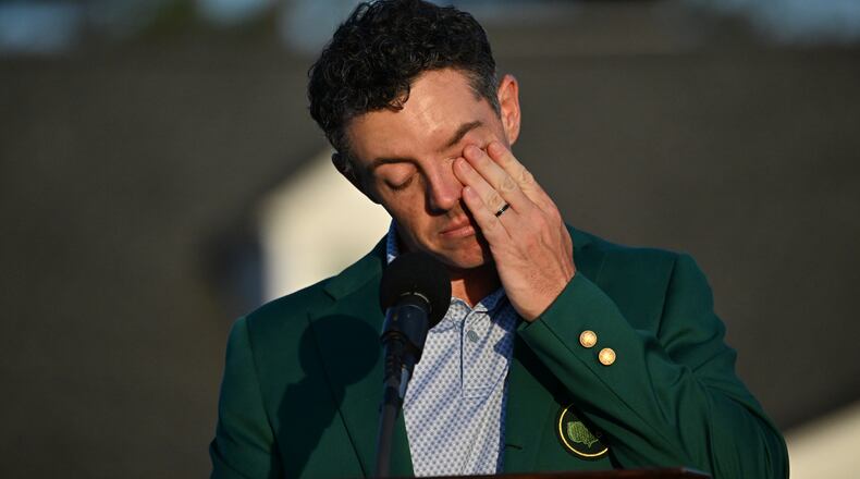 Masters champion Rory McIlroy wipes away a tear at the Green Jacket Ceremony at Augusta National Golf Club on April 12, 2026 in Augusta, Ga. (Hyosub Shin/AJC)