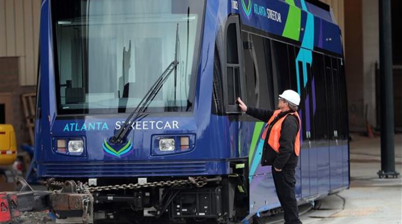 February 17, 2014 Atlanta: Mike Tomshaw, a MARTA contractor, gets a close look a the first Atlanta Streetcar to arrive Monday afternoon February 17, 2014 in Downtown Atlanta. The train was placed on its tracks, unwrapped and put in its maintenance barn after arriving from Sacramento. BEN GRAY / BGRAY@AJC.COM The federal government pitched in $47 million to fund Atlanta's streetcar. That's about $47 million more than was spent to track the number of non-criminals killed by U.S. police. (AJC file photo)