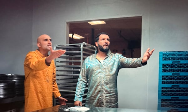 Atlanta resident Ahmed Lucan (right) plays a board member of the drug syndicate in the comedy "Deli Boys." (Courtesy of Hulu)