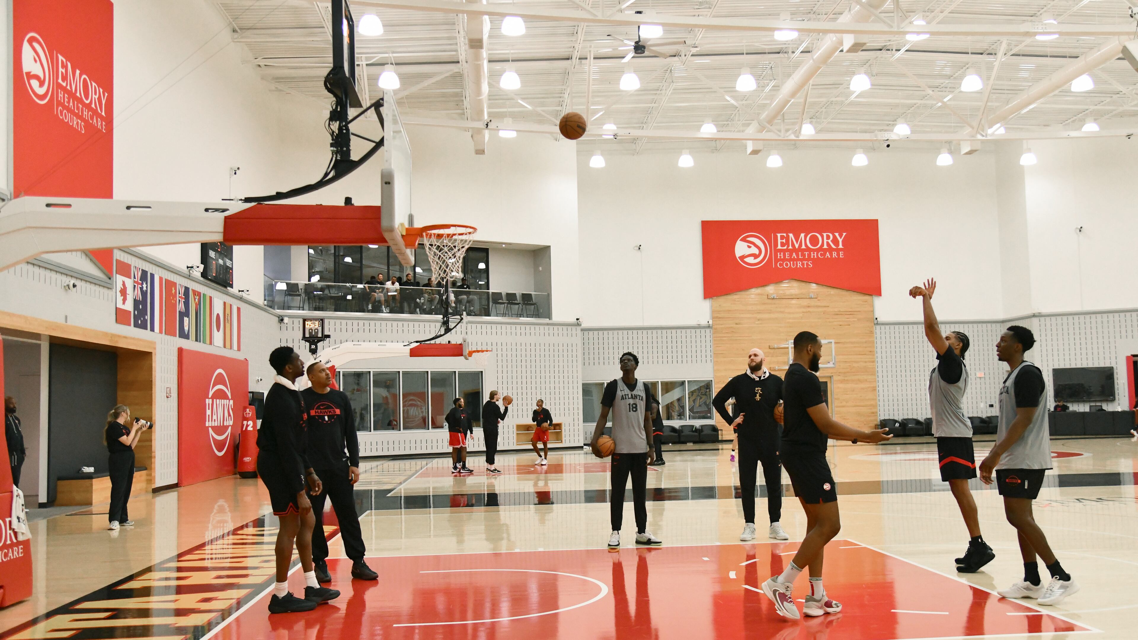 On the wall behind the backboard are some of the flags the Hawks have hung on the walls at the Emory Sports Medicine Complex to acknowledge the team's many international ties. (Hyosub Shin/AJC)