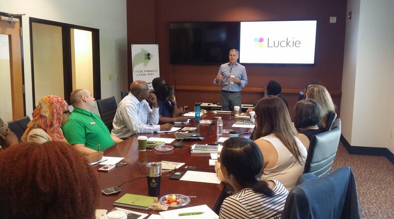 Luckie & Co. President John Gardner speaks with several high school marketing teachers during Back To Industry Day for educators of Gwinnett Public Schools. Through the initiative, teachers of several career fields learn from members of the community and the industries they serve. Photo by Nicholas Wolaver for Luckie & Co.