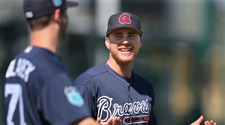 Braves pitcher Jacob Lindgren shares a laugh with Adam Kolarek while loosening up for practice during spring training at Champion Stadium on Sunday Feb. 19, 2017, at the ESPN Wide World of Sports in Lake Buena Vista, Fla. Curtis Compton/ccompton@ajc.com
