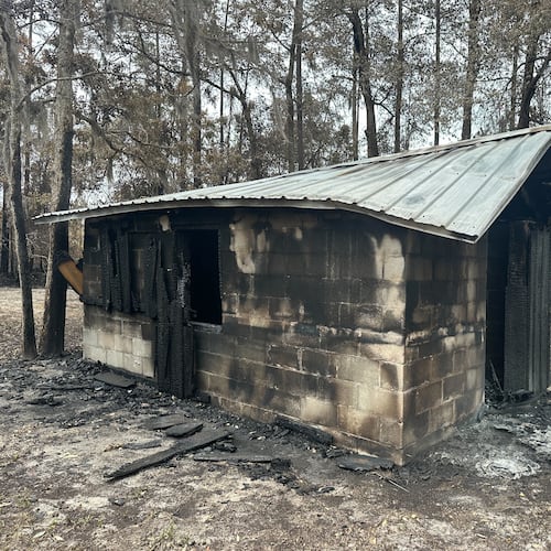 A charred cinderblock shed stands near the Waynesville community in Brantley County, Ga., on Monday, April 27, 2026. (AP Photo/Russ Bynum)