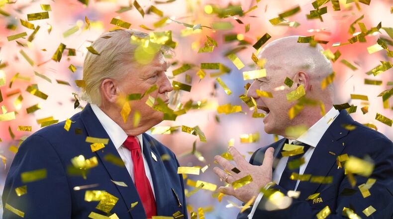 President Donald Trump, left, speaks with FIFA President Gianni Infantino as confetti falls at the conclusion of the World Cup championship final soccer match between Spain and Argentina in East Rutherford, N.J., Sunday, July 19, 2026. (AP Photo/Jacquelyn Martin)