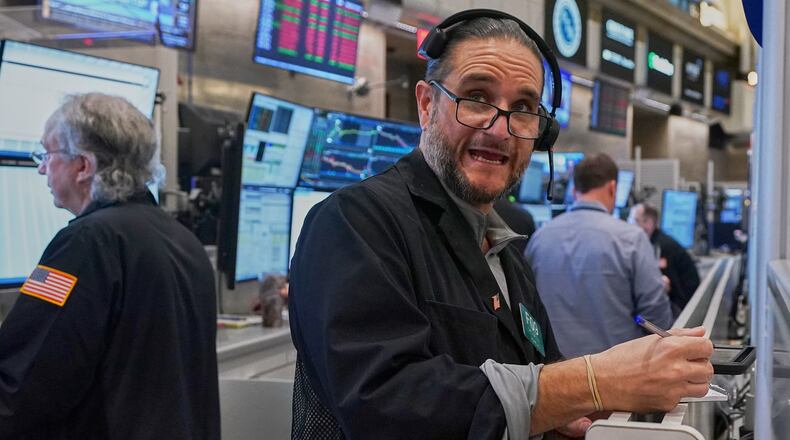 Options trader Chris Dattolo works on the floor of the New York Stock Exchange, Wednesday, May 13, 2026. (AP Photo/Richard Drew)