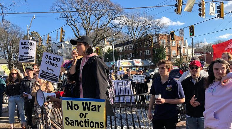 Claudia Andrade of Answer Coalition says the U.S. needs to focus on problems at home during a Saturday protest of American military action in Iraq. The Atlanta rally was one of several such events scheduled in cities across the nation on Saturday, January 4, 2019. (Photo: Leon Stafford/AJC)